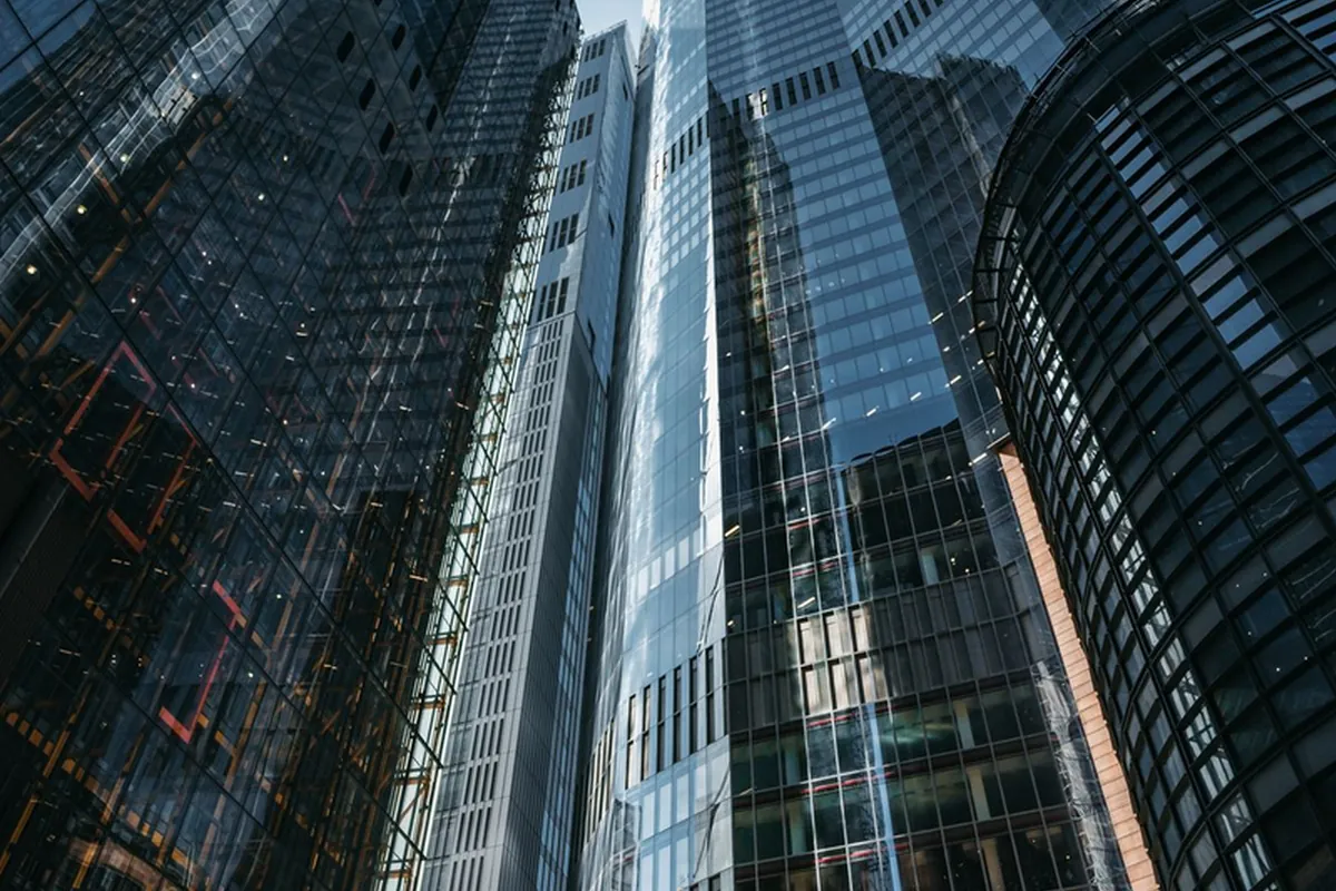 Modern glass bank tower in Dubai at blue hour